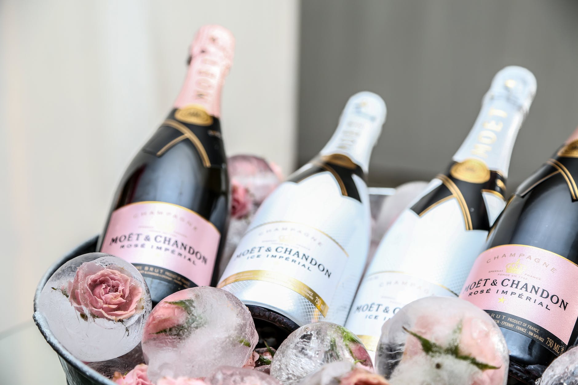 four wine bottles on ice bucket